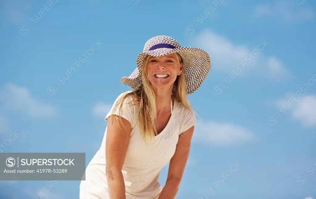 Portrait of relaxed mature woman having gala time outdoors