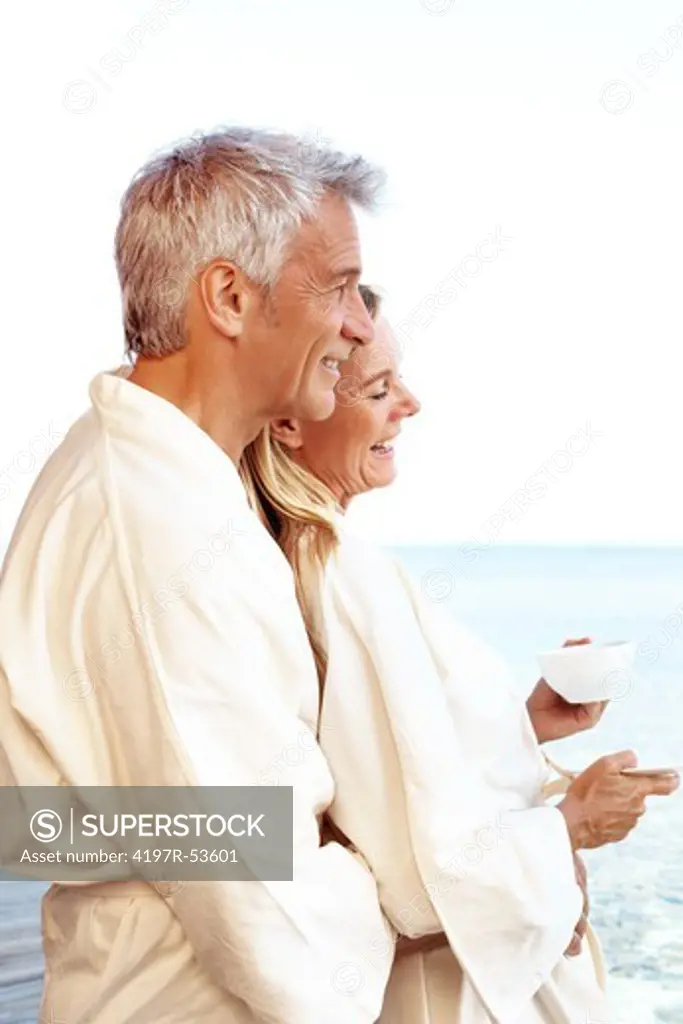 Relaxed mature couple enjoying morning tea - Outdoors