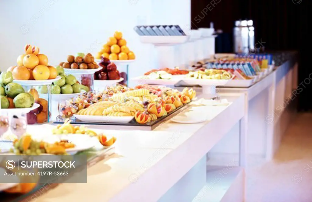 Image of variety of fancy salads and food displayed at buffet at restaurant