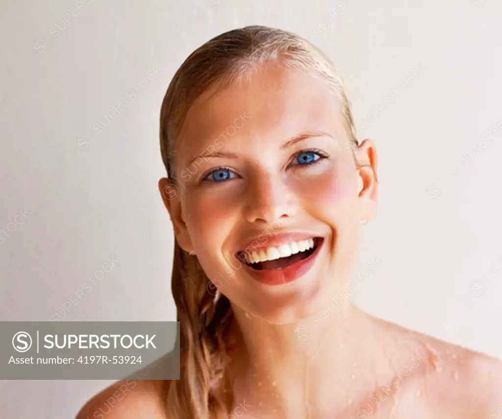 Happy beautiful young woman having fresh shower