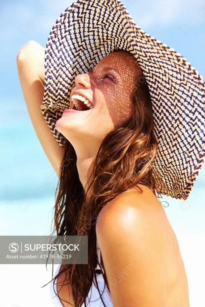 Closeup of young woman enjoying at sunny day on beach