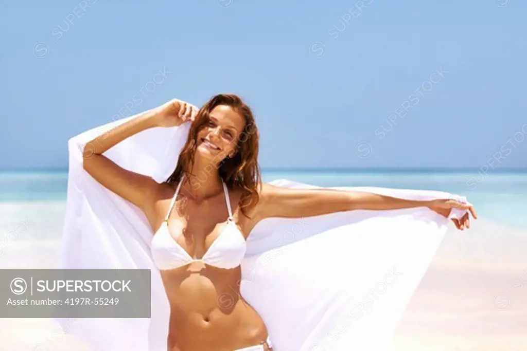 Portrait of gorgeous beach woman with white sarong