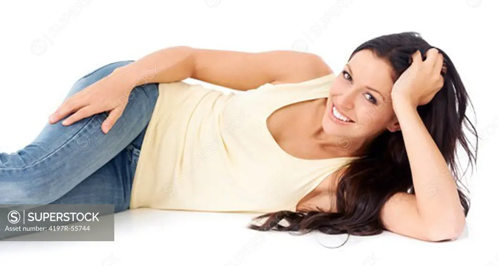 Portrait of a pretty young woman lying on the floor on a white background