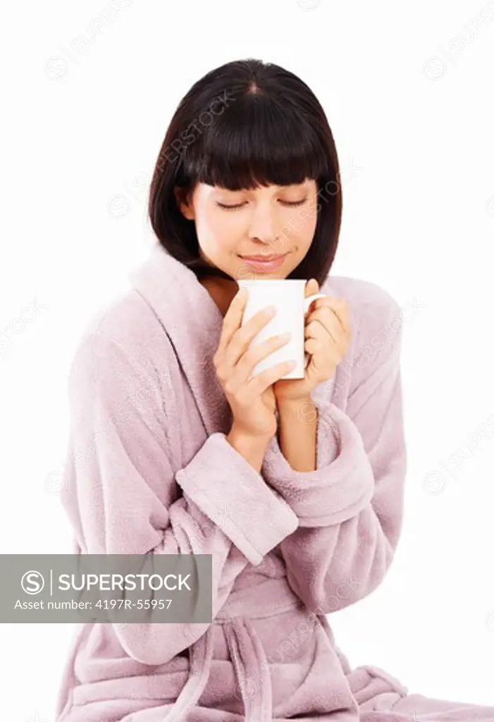 Cute young woman enjoying a fresh cup of coffee