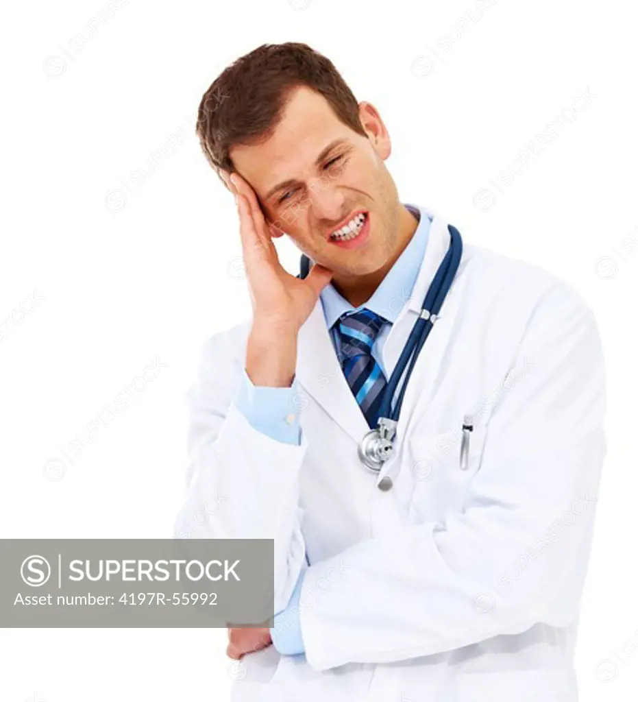 A young doctor rubbing his temple on a white background