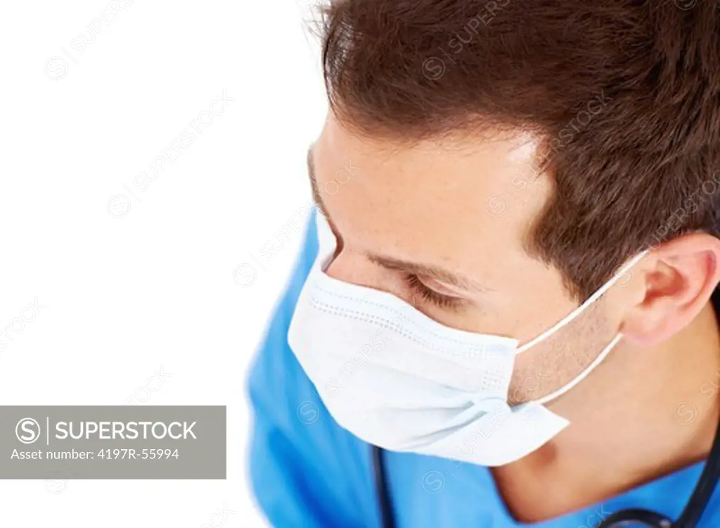A young surgeon wearing a mask on a white background