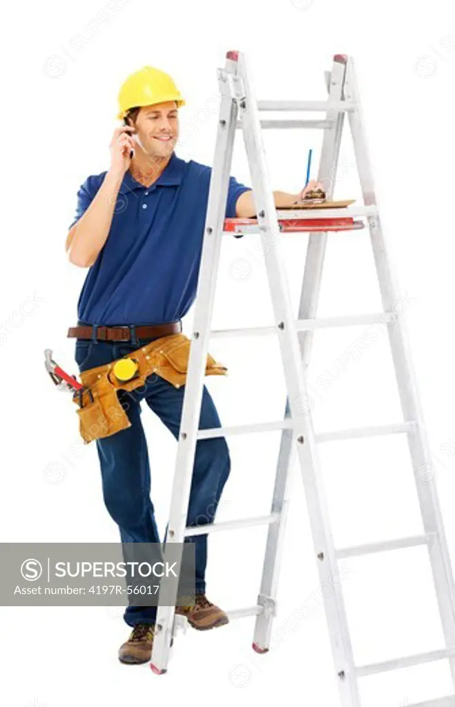 A young handyman talking on the phone while standing on a ladder