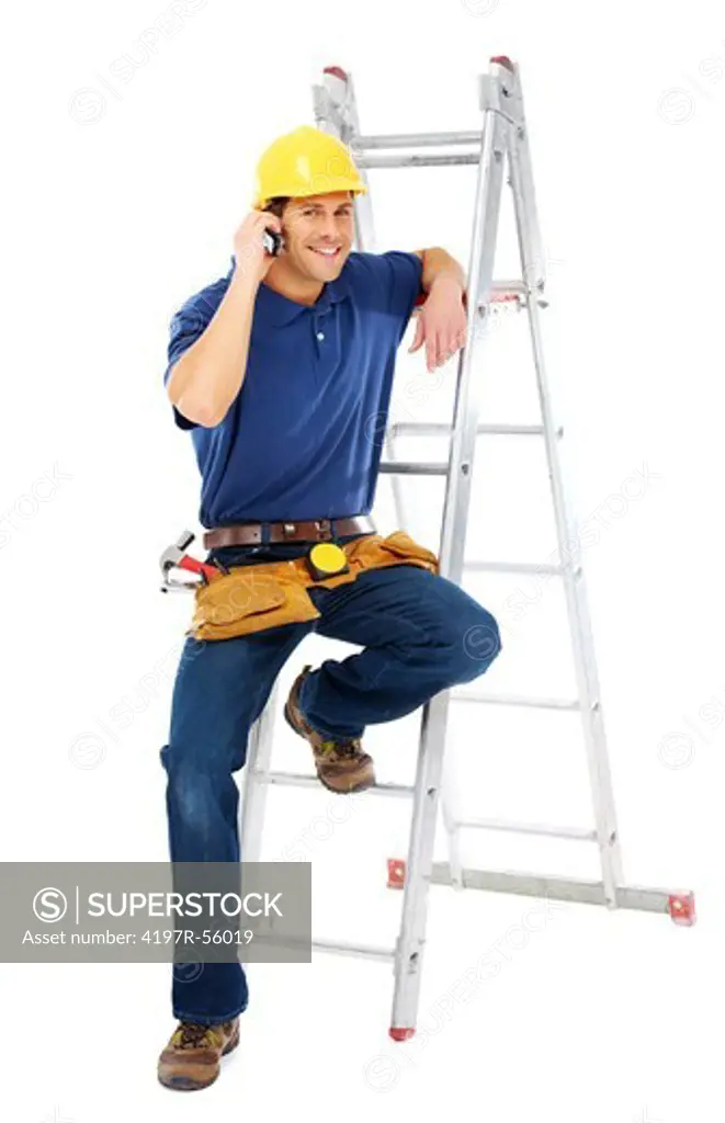 A young handyman talking on the phone while leaning on a ladder