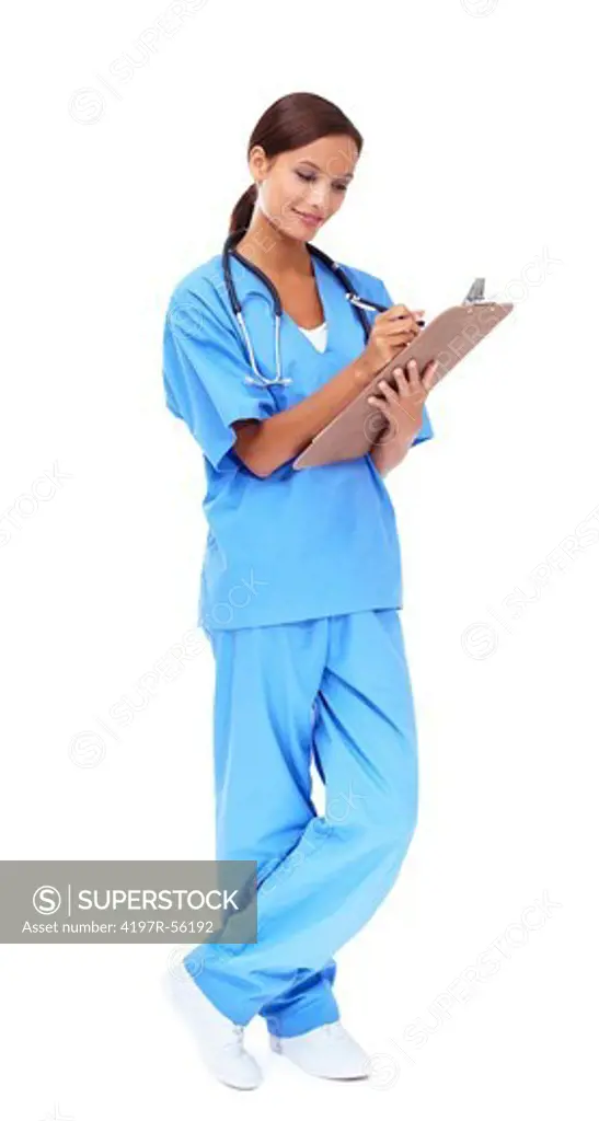 Thoughtful young doctor writing in a medical report while isolated on white - full-length