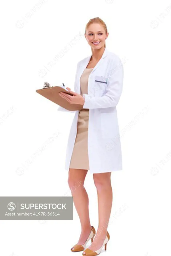 Beautiful female doctor glances sideways while smiling and holding a clipboard