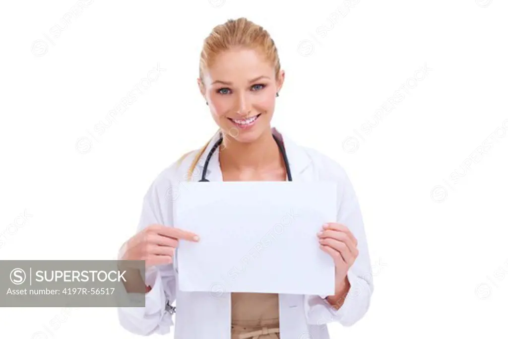 Smiling young doctor pointing to a blank piece of paper - copyspace