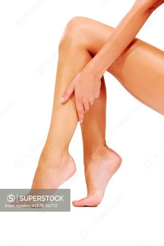 Cropped image of a woman sitting down and rubbing her calf