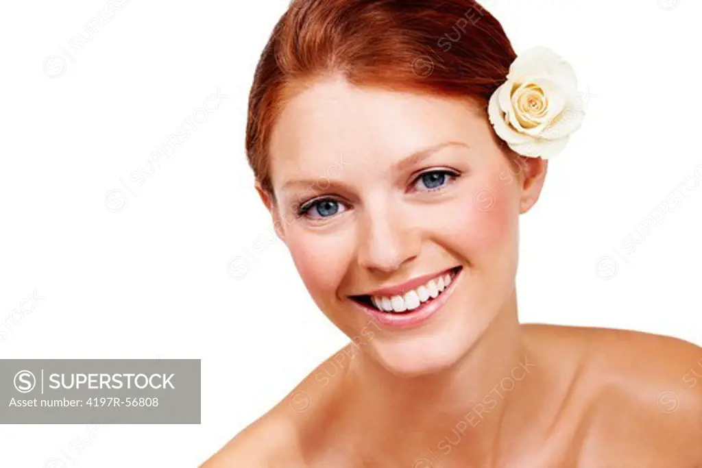 Portrait of an attractive young woman with a white rose on her ear