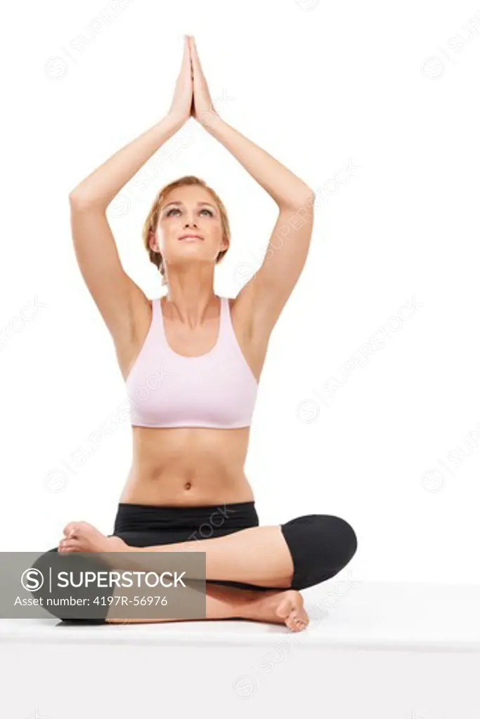 A beautiful woman performing the sitting routine during a yoga routine - Isolated