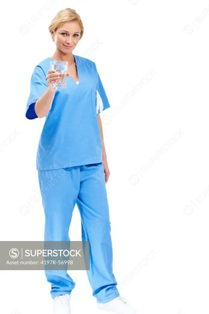 Full-length portrait of a nurse holding a glass of water while isolated on a white background