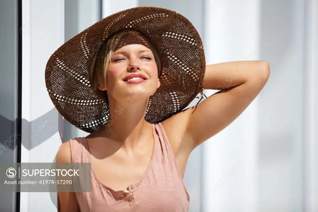 A beautiful young woman relishing the warmth of the summer sun