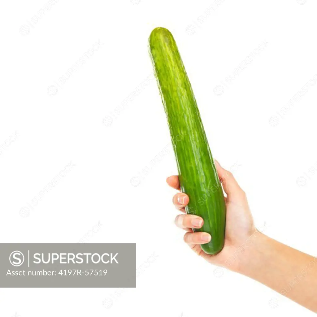 Cropped view of a woman's hand holding a cucumber