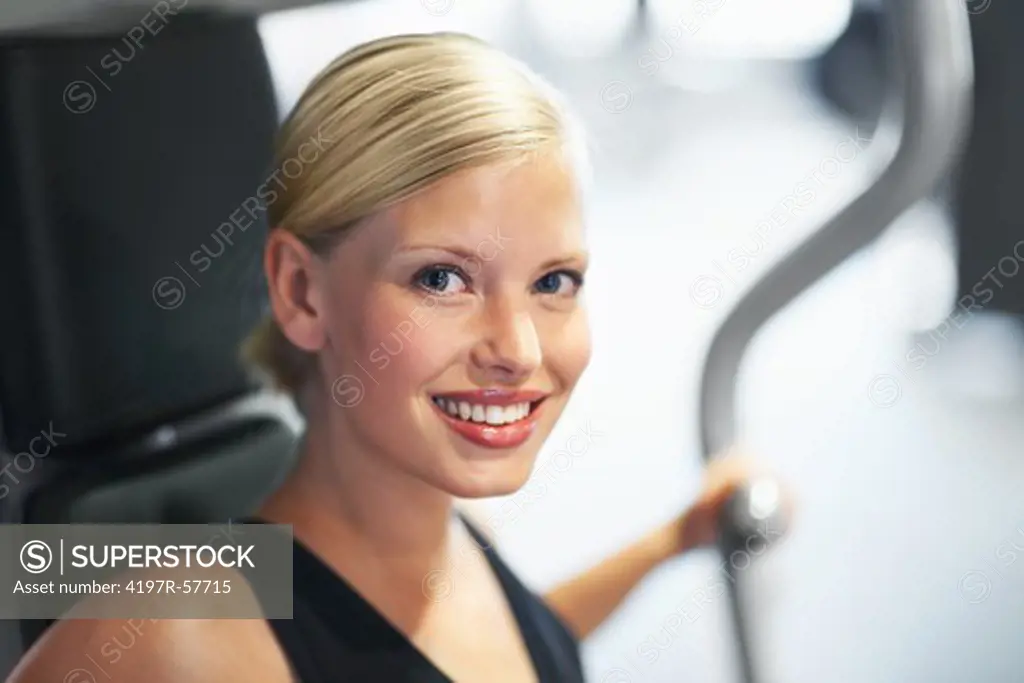Close-up portrait of an attractive young woman in the gym