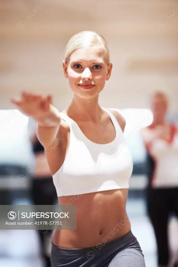 Portrait of a beautiful young woman teaching an aerobics class