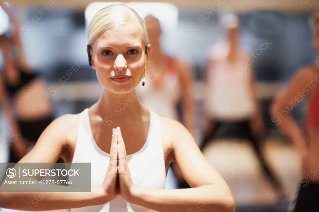Portrait of a stunning young woman leading a yoga class