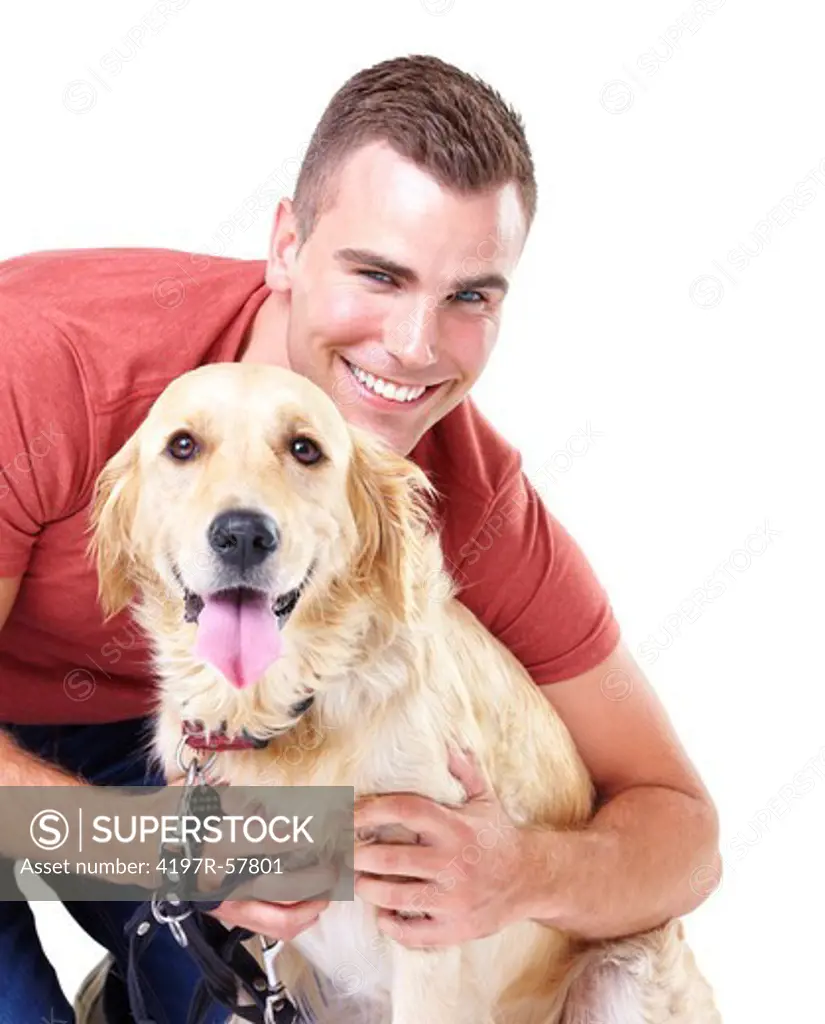 A handsome young man hugging his Golden Retriever