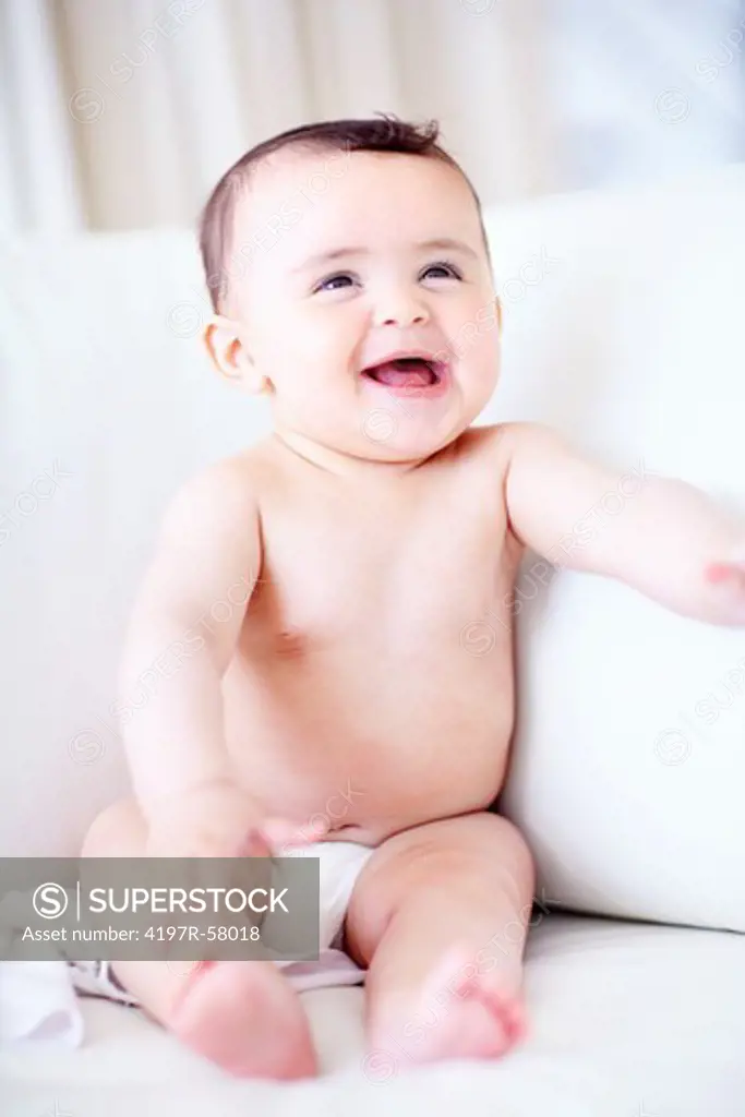 A cute baby boy laughing