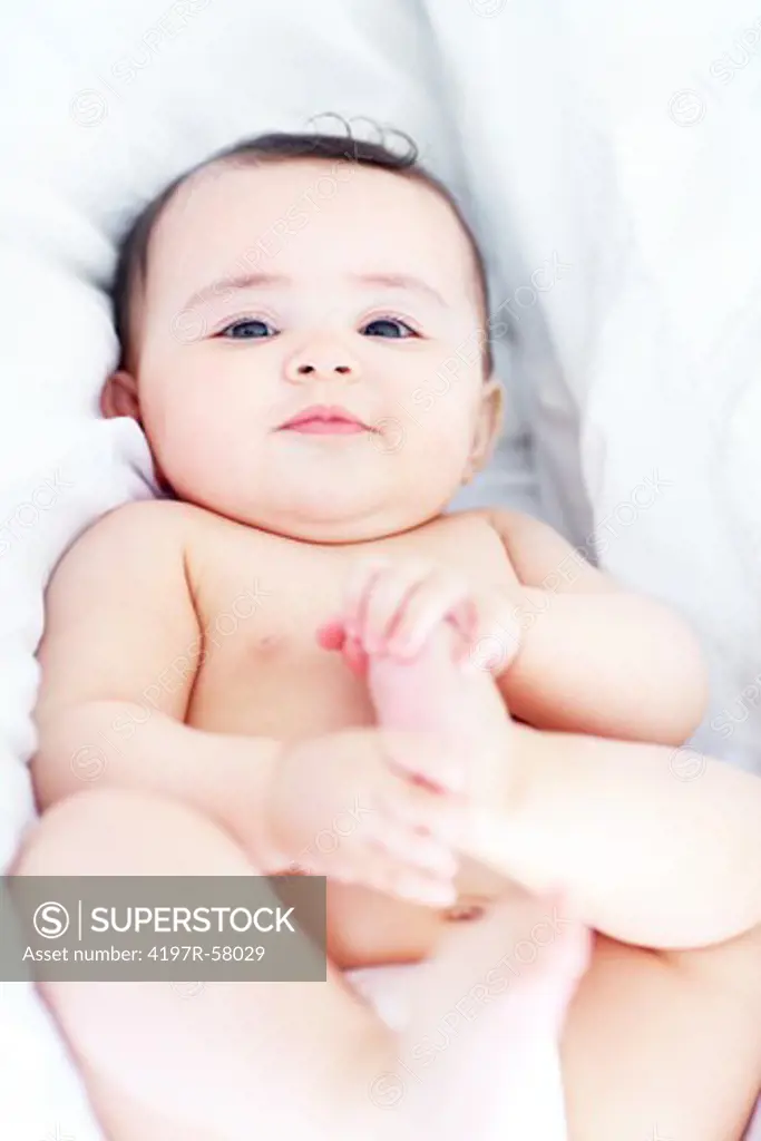 Portrait of an adorable baby boy lying down