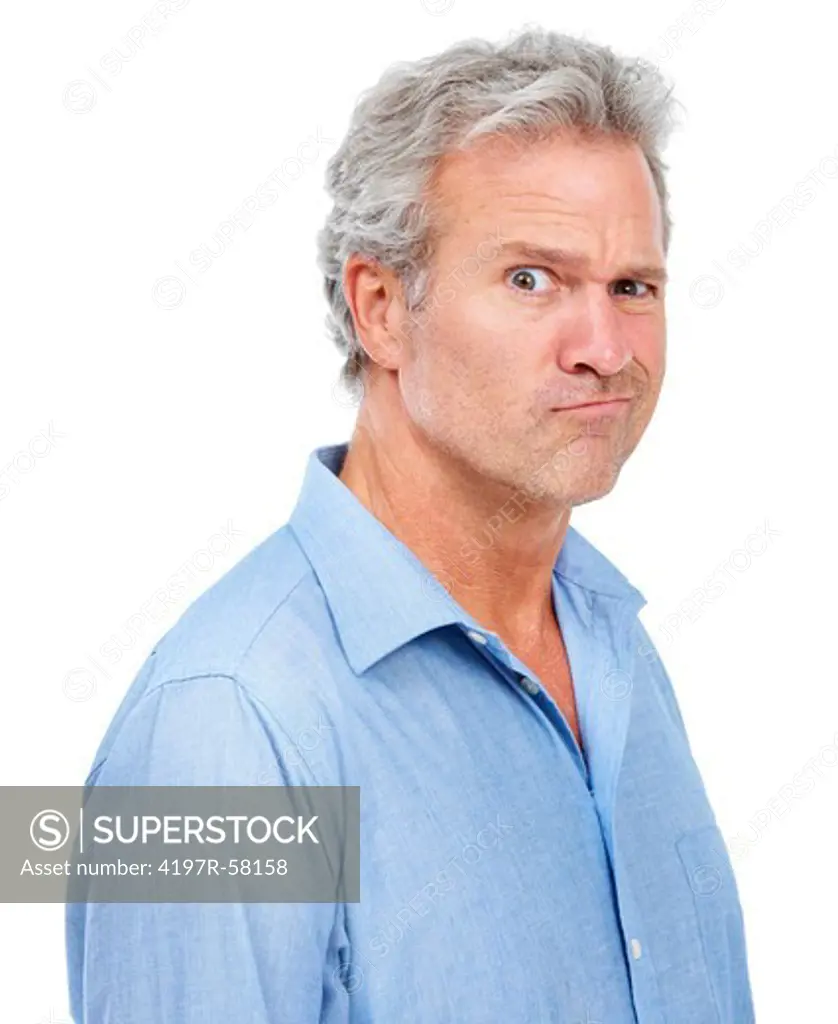 A comically skeptical mature man pulling a face while isolated on white