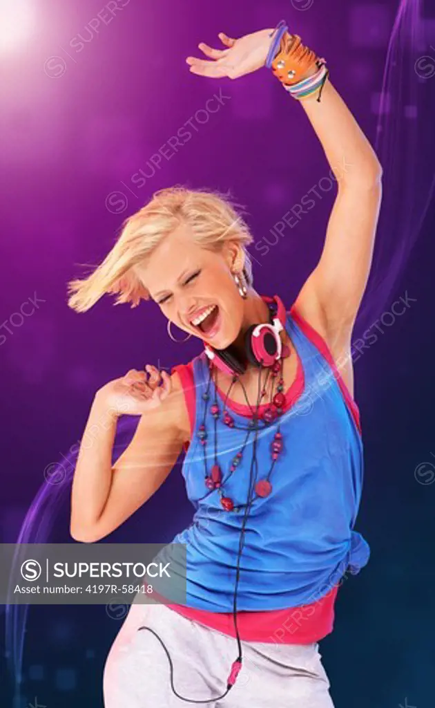 Digitally manipulated image of a trendy young girl in urban attire dancing against a background of colored lights