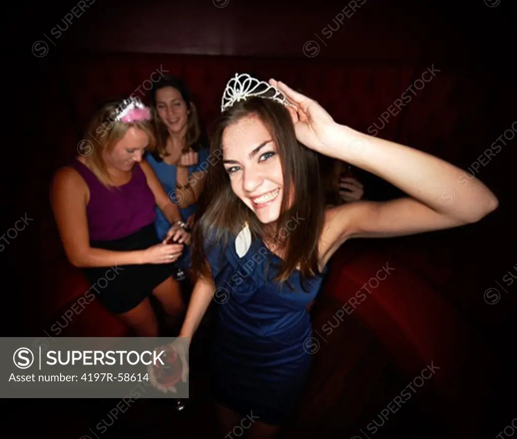 A pretty young girl out celebrating her birthday with her friends at a club