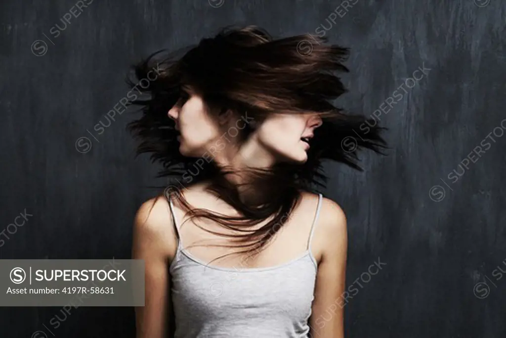 Studio shot of a young woman battling with multiple personality disorder