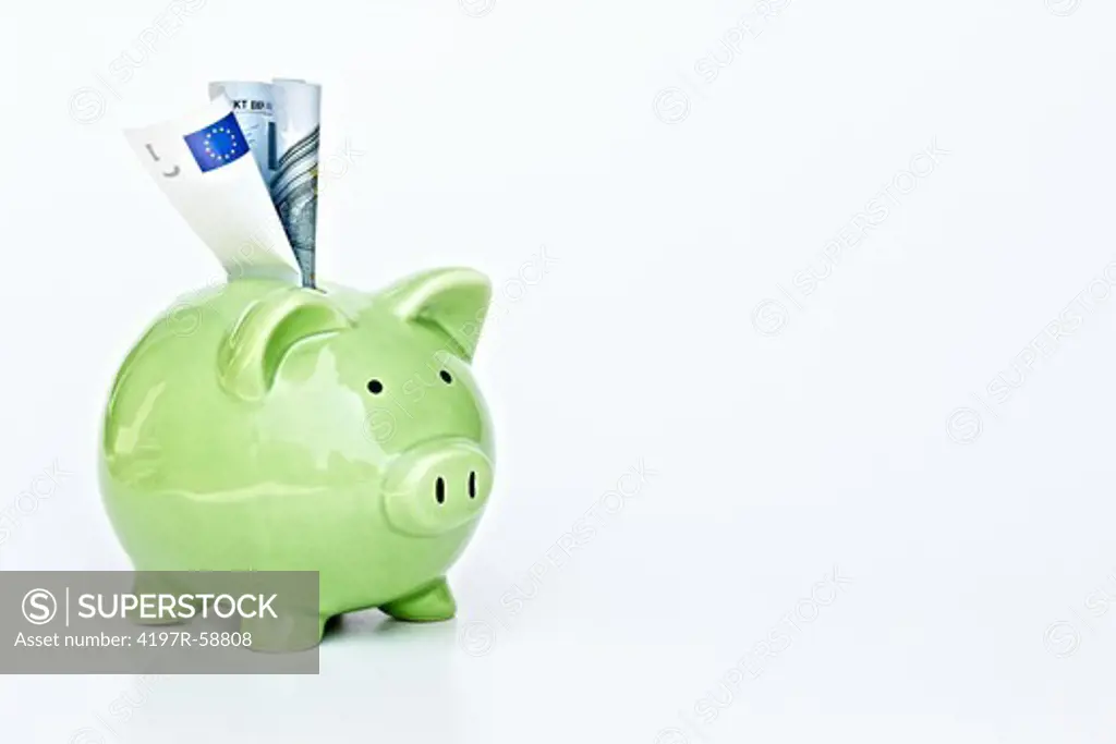 A piggybank with money in the slot