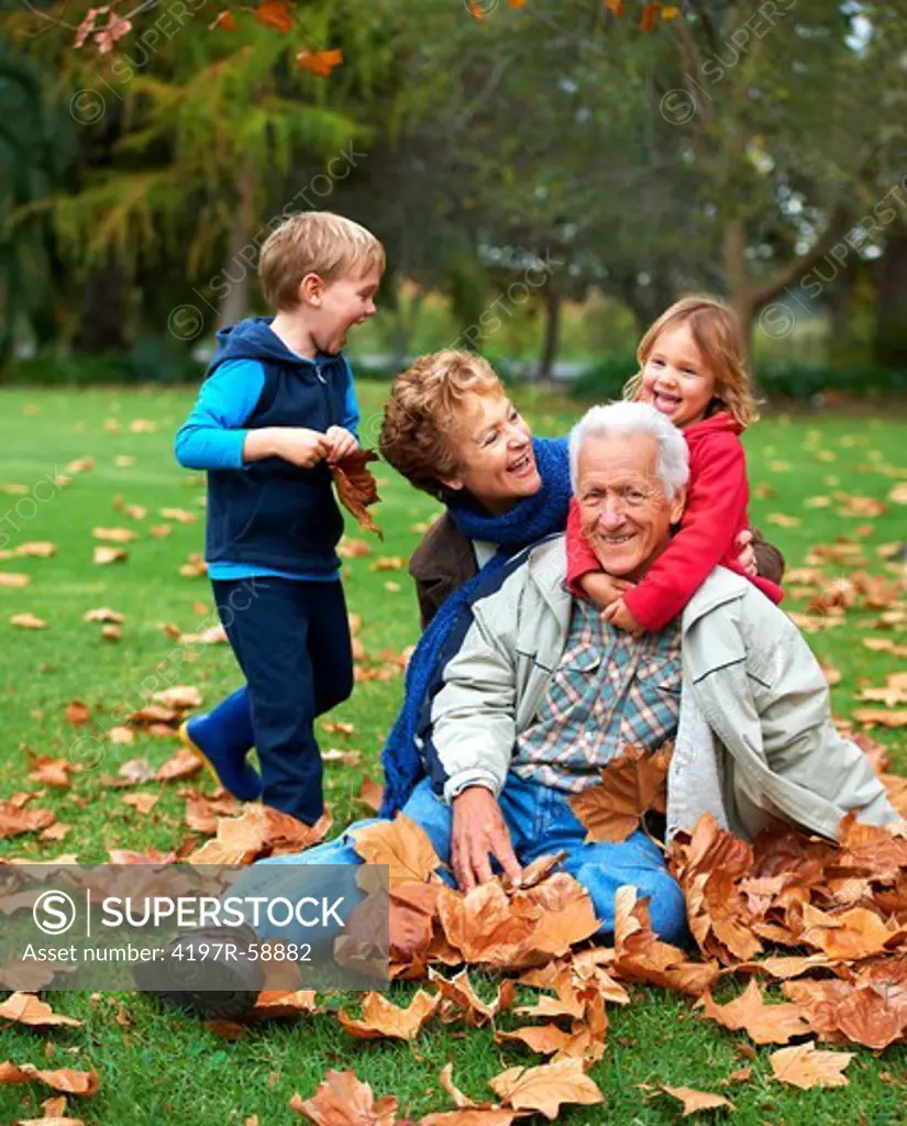 Grandparents playing outside with their grandkids