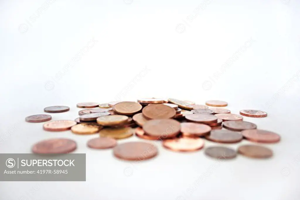 A studio shot of miscellaneous coins isolated on white