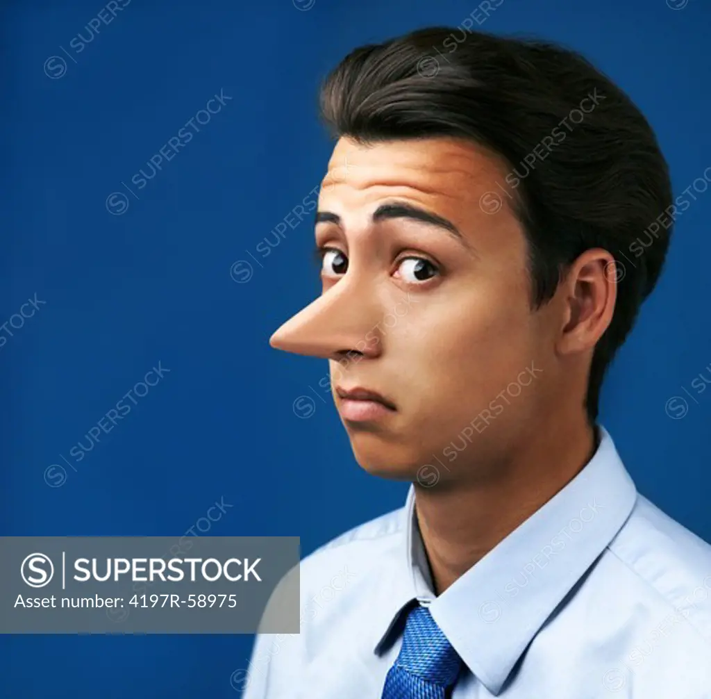 Handsome young man with a very long nose against a blue background