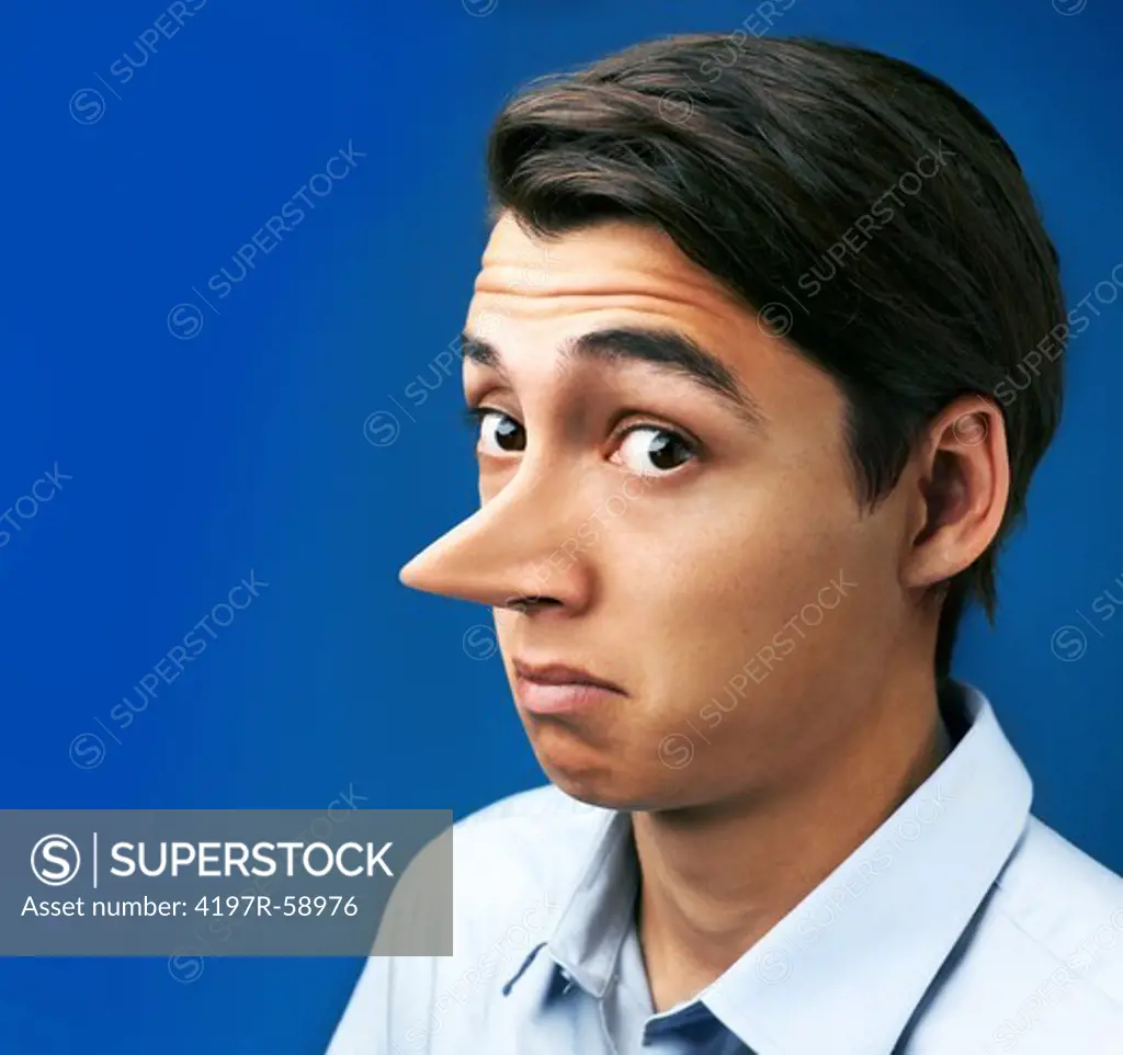 Handsome young man with a very long nose against a blue background