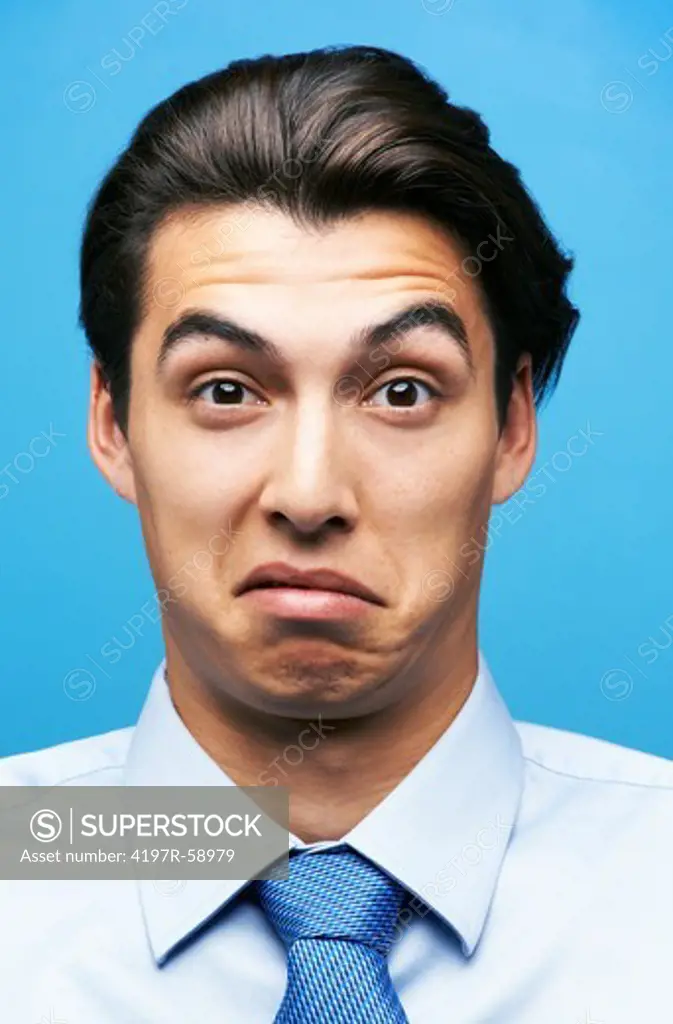 Young businessman with a digusted and confused expression