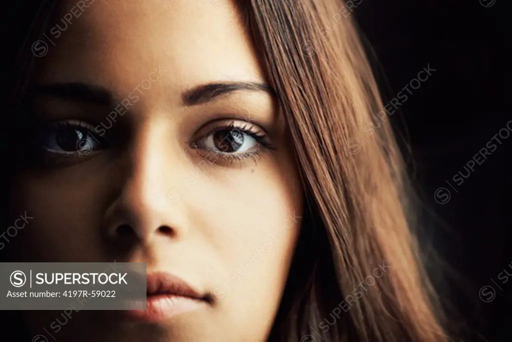 Close up of a gorgeous young latina woman gazing into the camera