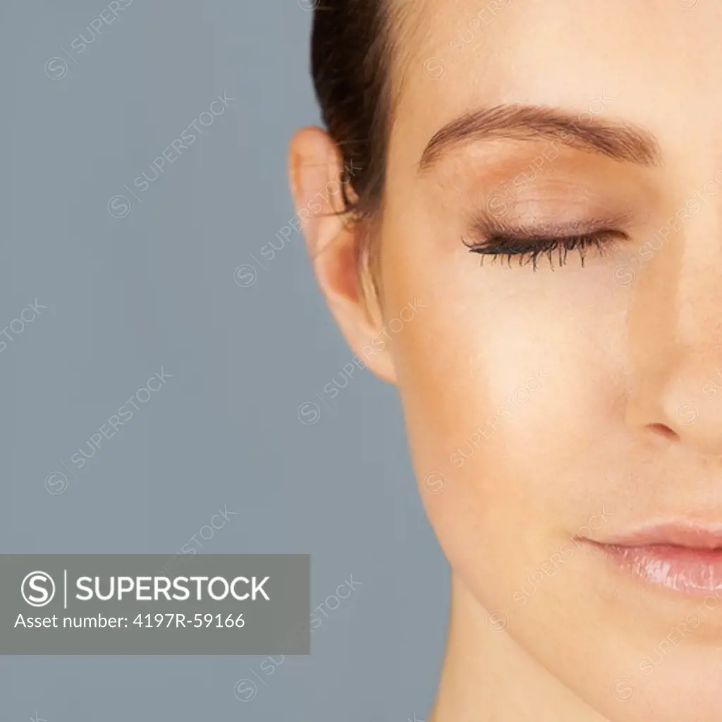 Cropped view of a beautiful and serene young woman's face