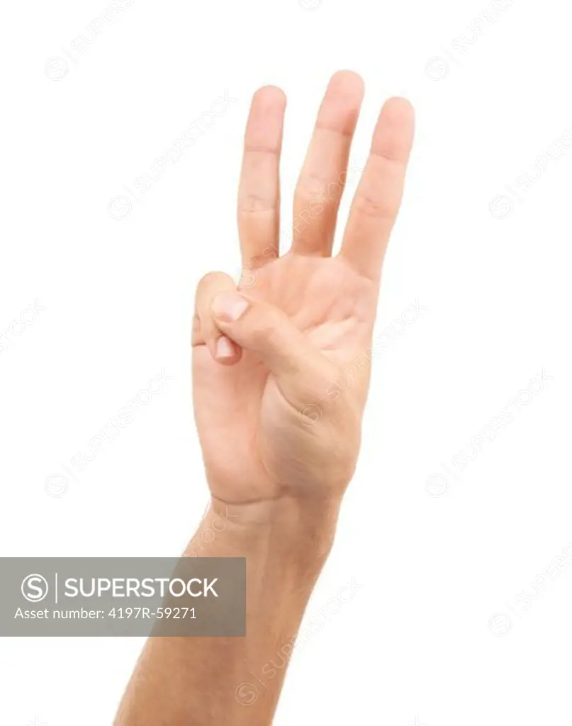 Cropped view of a hand indicating the number three with its fingers