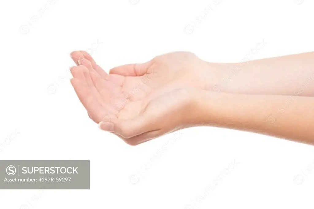 Cropped view of hands cupped over a white background
