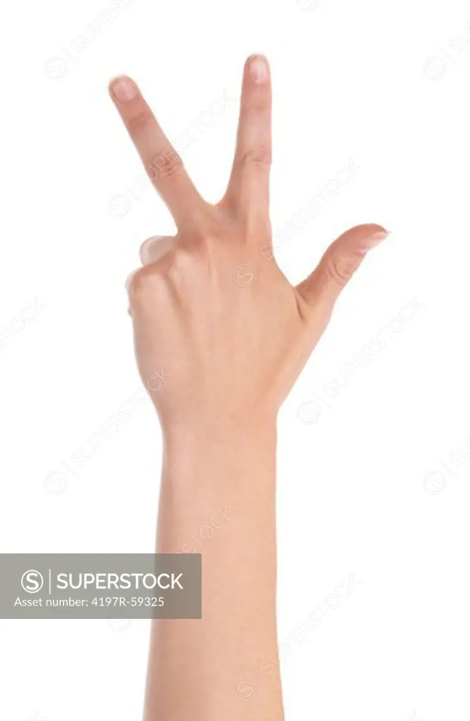 Cropped view of a hand indicating the number three with its fingers