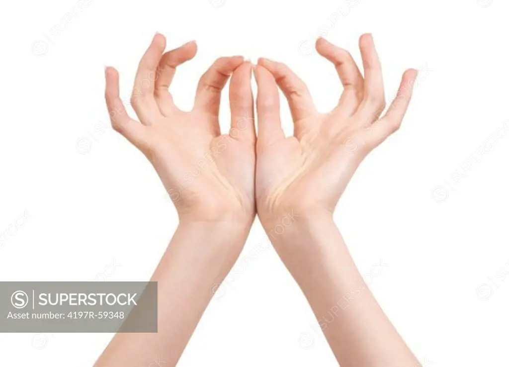 Cropped view of hands with fingertips poised to hold something very delicate and small