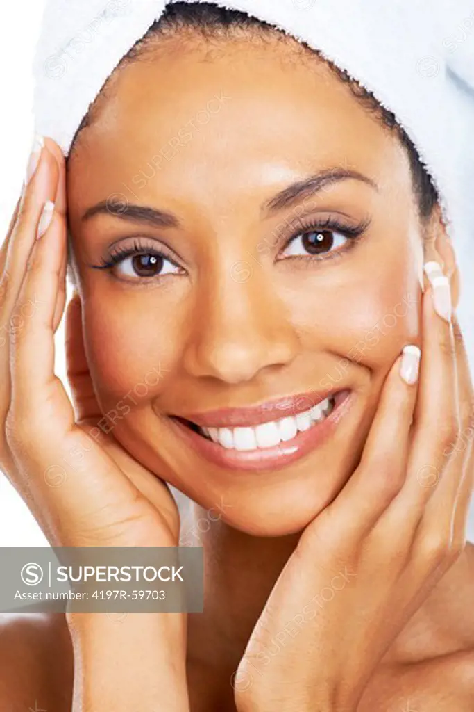 Closeup of a beautiful african american woman loving the feel of her skin after a spa treatment