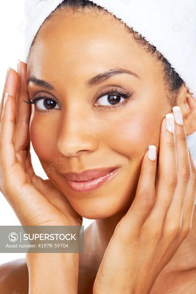 Closeup of a beautiful african american woman loving the feel of her skin after a spa treatment