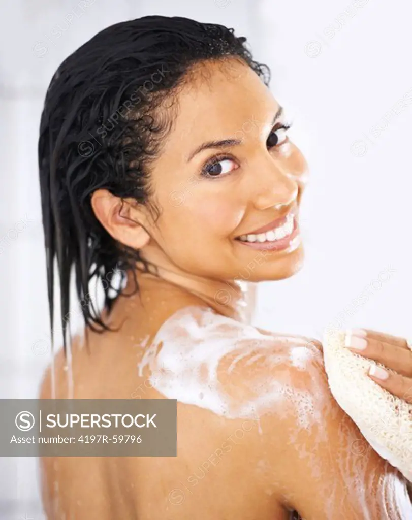 Portrait of an attractive ethnic woman showering