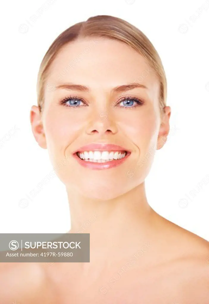 Closeup of a pretty young blonde woman smiling while against a white background