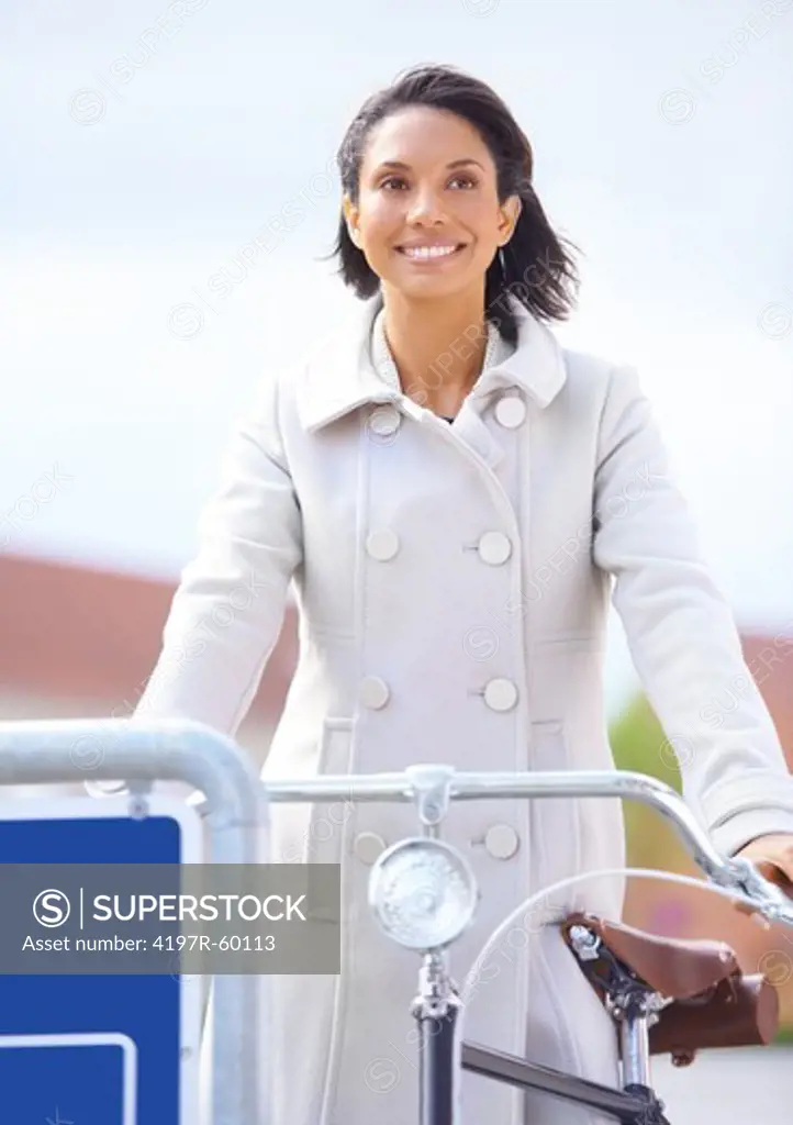 Attractive young woman on a bicycle in a new town
