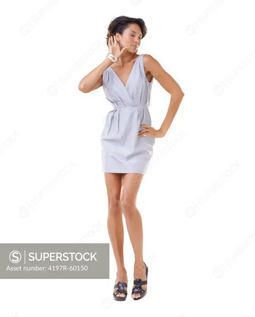 Posh young African-American woman making a listening gesture while against a white background