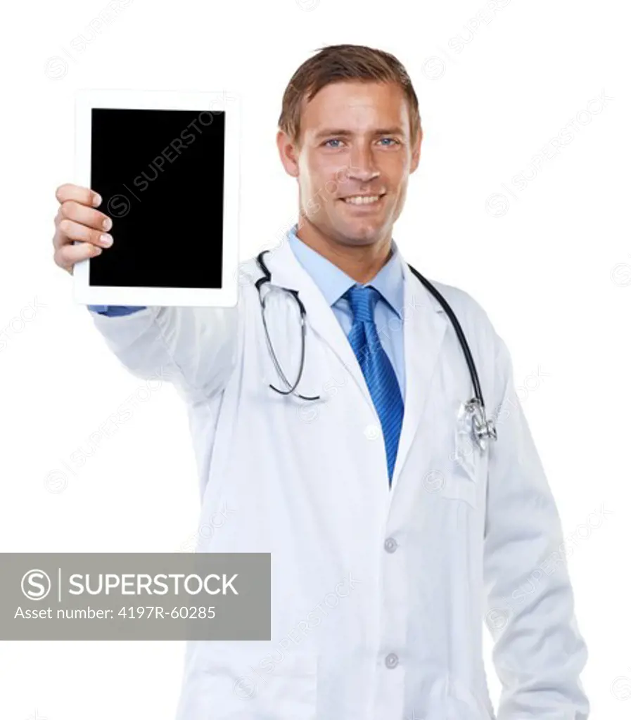 Studio portrait of a confident young doctor showing you a blank-screened digtal tablet isolated on white